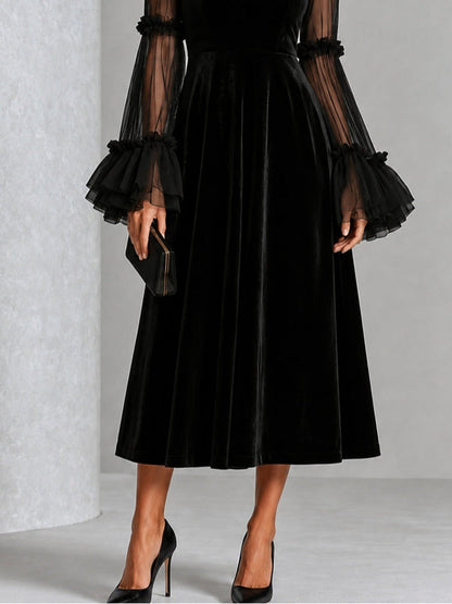 Berenice | Robe midi noire en velours à manches en tulle
