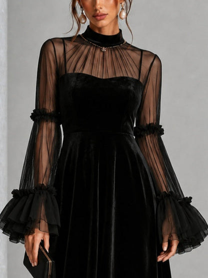Berenice | Robe midi noire en velours à manches en tulle